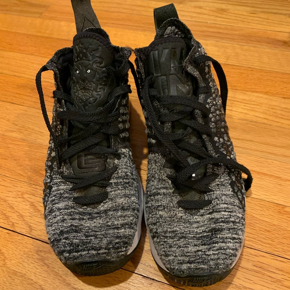Used youth boys Lebron sneakers. Broken loop in the back.
